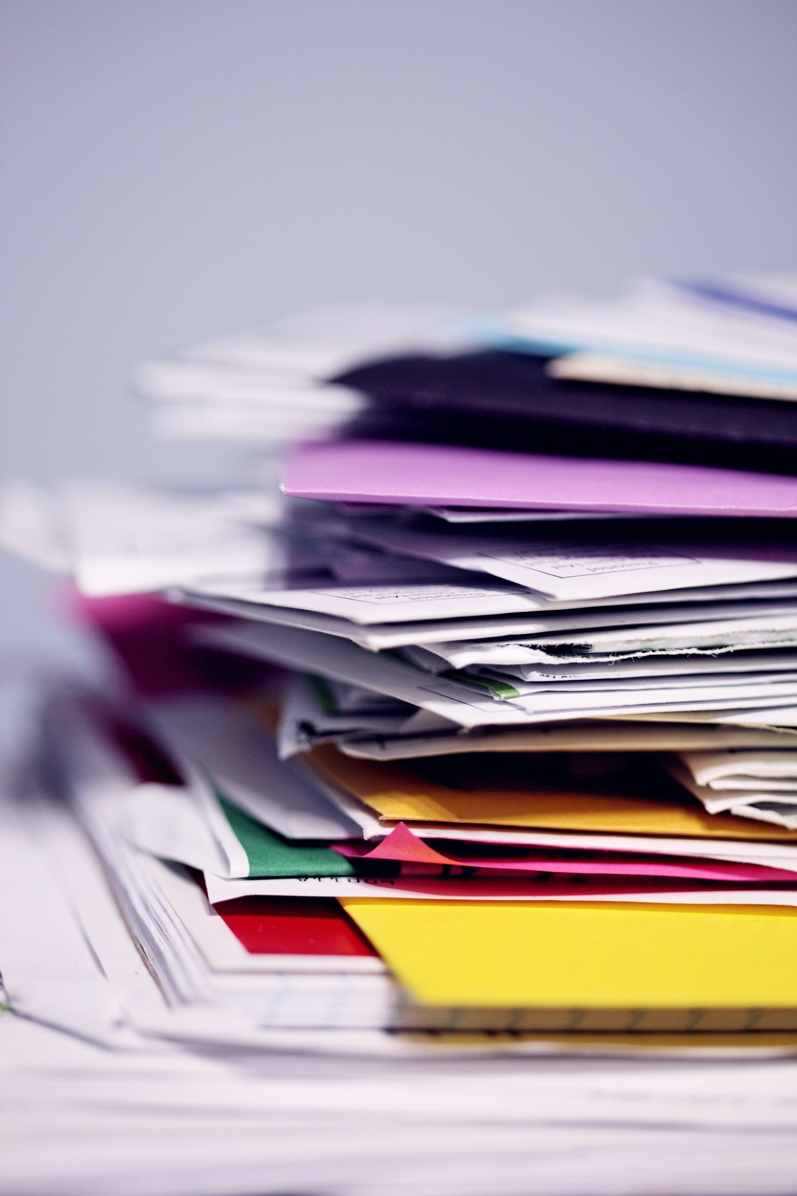 A large stack of printed paper documents
