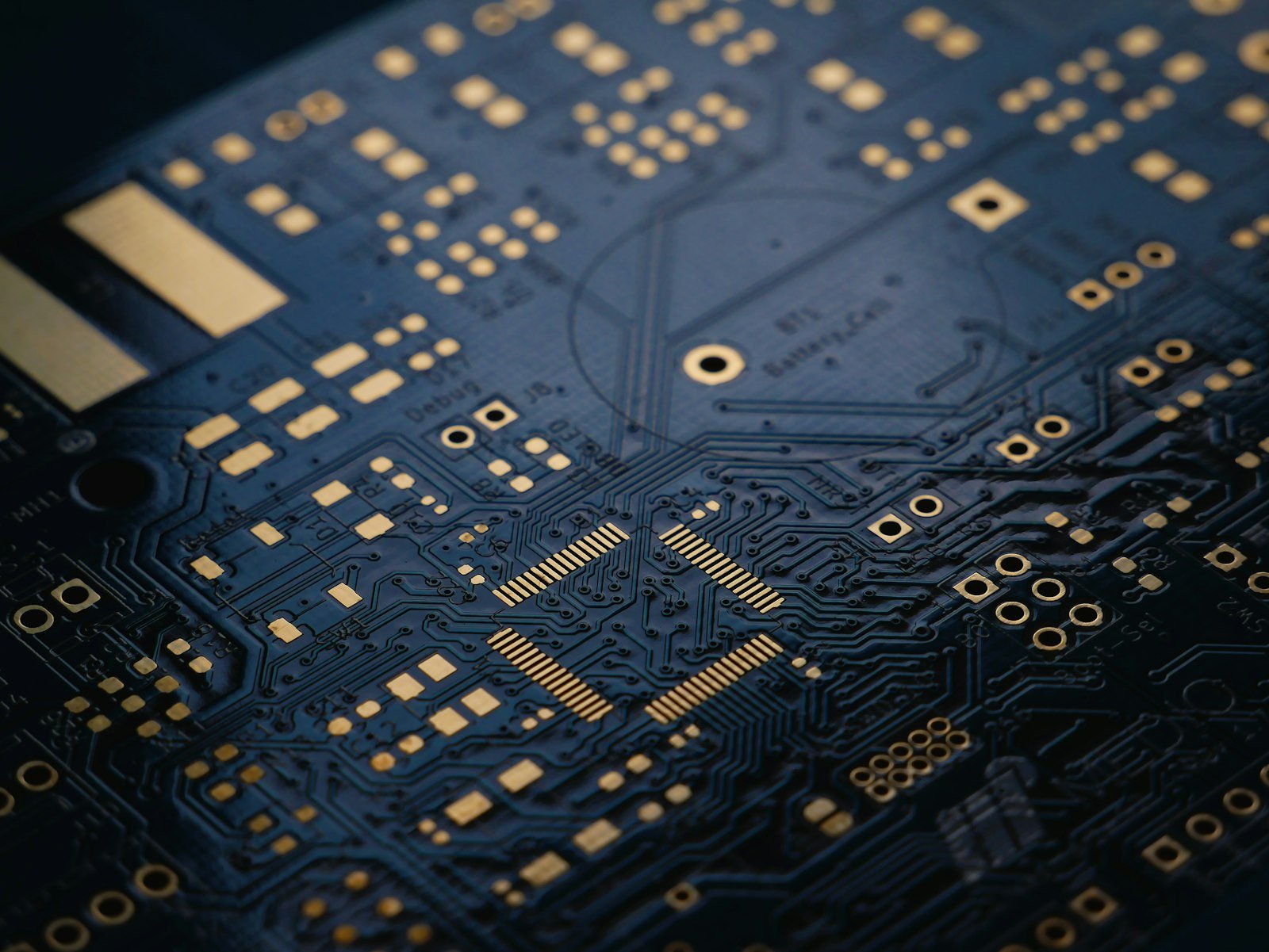 A close-up of a dark blue printed circuit board